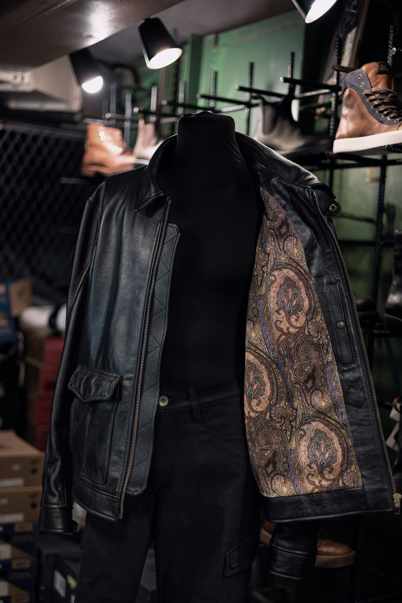 a mannequin wearing a leather jacket and pants